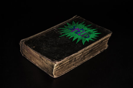 Old black book over black backgroundの写真素材