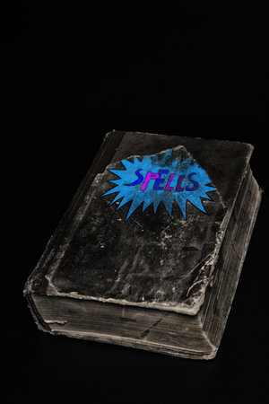 Old black book over black background