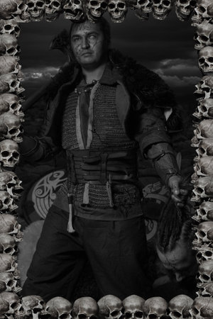 Strong scandinavian warrior posing with head of his enemyの写真素材