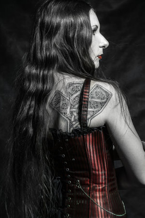 Gothic girl over dark backgroundの写真素材