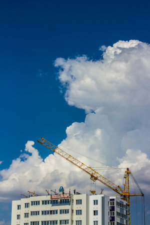 Tower crane over blue sky