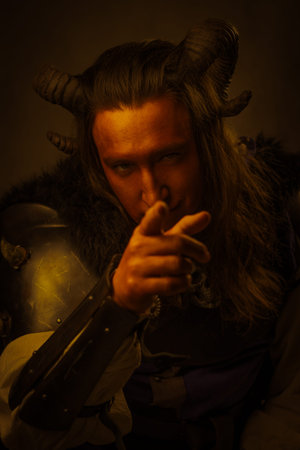 Cinematic fantasy portrait of a tiefling character with curved horns and long hair, wearing dark...