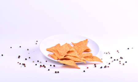 plate with potato chips on white backgroundの写真素材