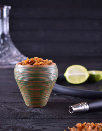 hookah bowl with tobacco on a dark backgroundの写真素材
