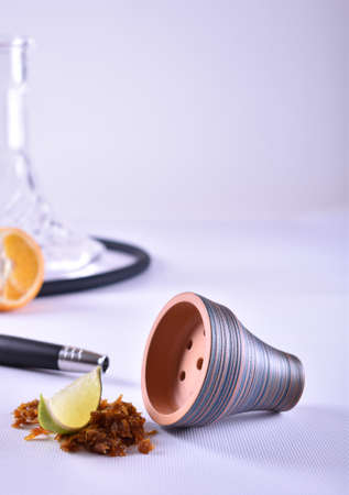 hookah bowl with tobacco on a light backgroundの写真素材