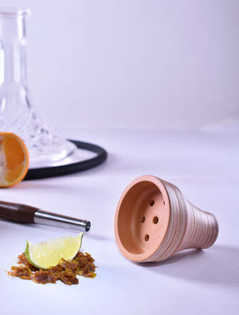 hookah bowl with tobacco on a light backgroundの写真素材