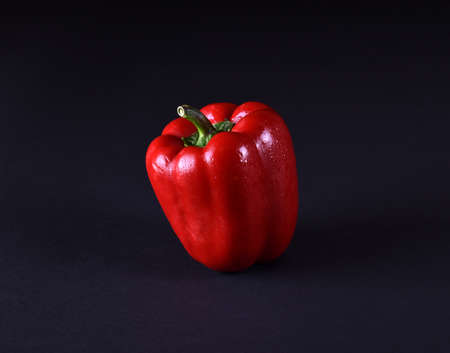 Red pepper on black on backgroundの写真素材