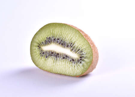 Freshly sliced kiwi on white backgroundの写真素材