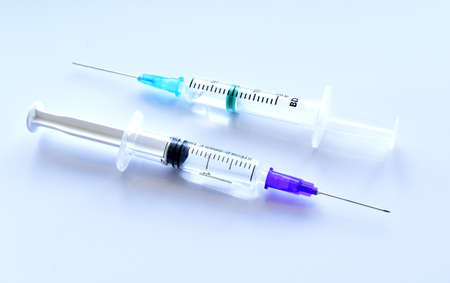 Medical syringe with a vaccine. Epidemic. Blood collection and injection conceptの写真素材
