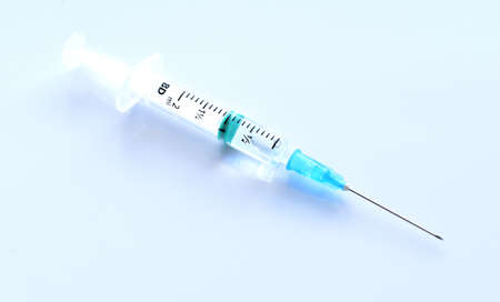 Medical syringe with a vaccine. Epidemic. Blood collection and injection conceptの写真素材