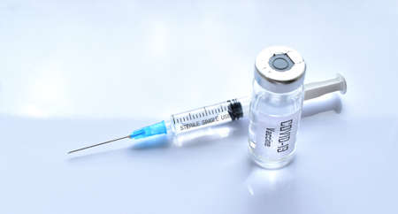 Vaccine against covid-19 and a syringe with a vaccine. Isolateの写真素材