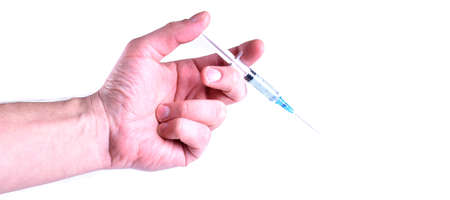 Syringe with vaccine in hand with place for textの写真素材
