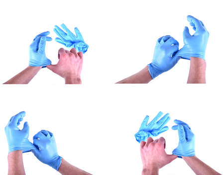 take off medical blue gloves on a white background. Isolated imageの写真素材