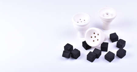 Hookah bowls with tobacco and charcoal for smoking on a white background. Space for text. Bannerの写真素材