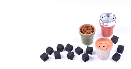Hookah bowls with tobacco and charcoal for smoking on a white background. Space for text. Bannerの写真素材
