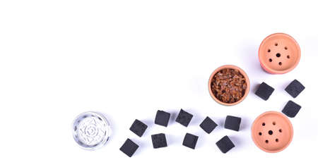 Hookah bowls with tobacco and charcoal for smoking on a white background. Space for text. Bannerの写真素材