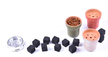 Hookah bowls with tobacco and charcoal for smoking on a white background. Space for text. Bannerの写真素材