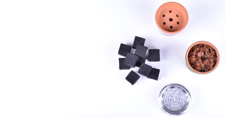 Hookah bowls with tobacco and charcoal for smoking on a white background. Space for text. Bannerの写真素材