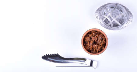 Hookah bowls with tobacco and charcoal for smoking on a white background. Space for text. Bannerの写真素材