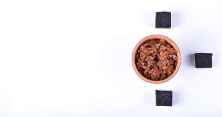 Hookah bowls with tobacco and charcoal for smoking on a white background. Space for text. Bannerの写真素材