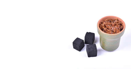 Hookah bowls with tobacco and charcoal for smoking on a white background. Space for text. Bannerの写真素材