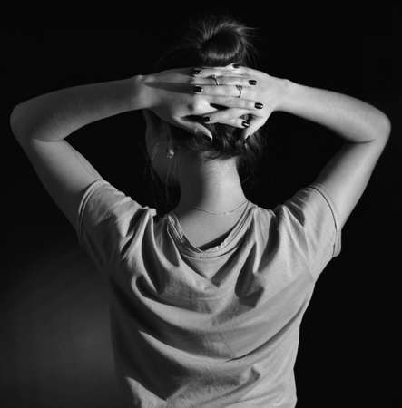 Photo of a young woman from behind. Monochromeの写真素材