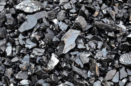 Enriched low-ash coal anthracite fines as a background.