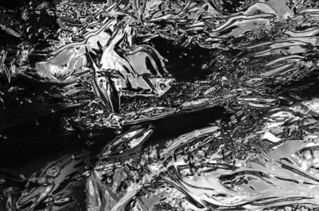 An abstract background similar to a liquid metal texture.の写真素材