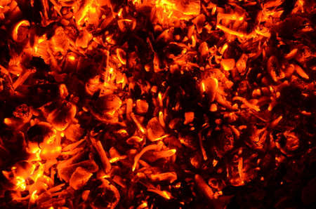 The graphic resource consists of glowing charcoals from an extinct fire.