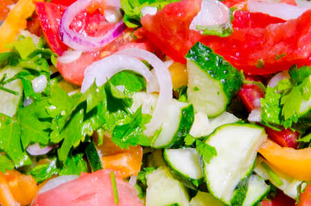 A colorful, appetizing juicy salad made from a variety of vegetables and spices.の写真素材