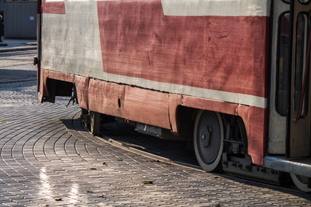 Old soviet union tram rides on rails in the cityの写真素材