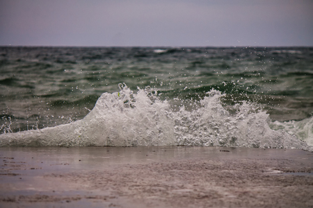 Powerful sea splash wave with sprays and foamの写真素材