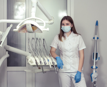 Female dentist  waiting for patient in the dental clinicの写真素材