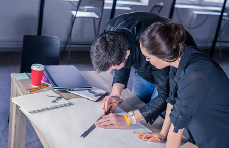 Team of architects people drawing new construction project on desk. business workflow. office...