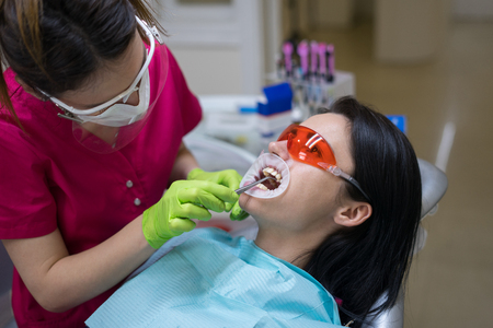 female patient at dentist in the clinicの写真素材