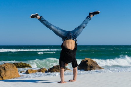 Handstand at the beachの写真素材
