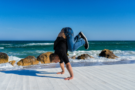 Handstand at the beachの写真素材