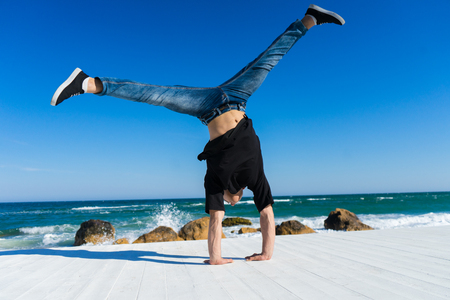 Handstand at the beachの写真素材