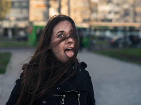 emotions of beautiful young girl in the cityの写真素材