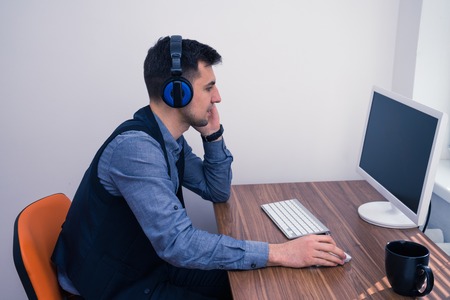 handsome man in call center with headphonesの写真素材