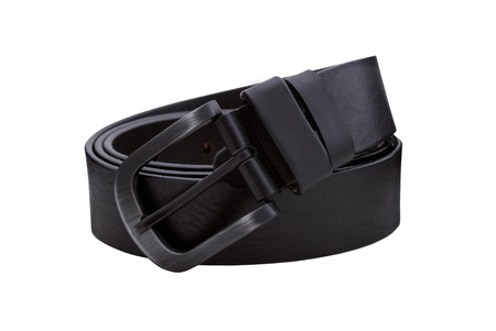 Rolled mens leather belt with metal buckle isolated on whiteの写真素材