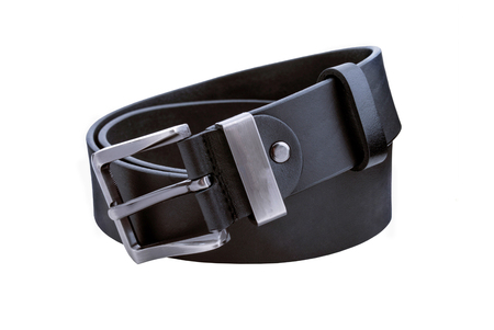 Rolled mens leather belt with metal buckle isolated on whiteの写真素材