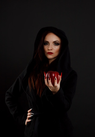 Stepmother witch gives poisoned red appleの写真素材