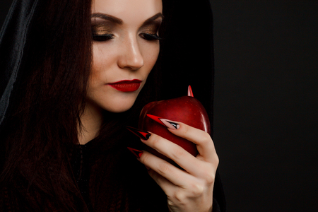 Stepmother witch gives poisoned red appleの写真素材
