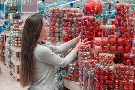 customer girl choosing gifts for Christmas and New Yearの写真素材