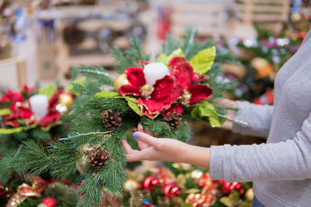 customer woman choosing Christmas decorationsの写真素材