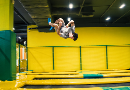 trampoline jumper performs acrobatic exercises on the trampoline
