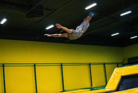 trampoline jumper performs acrobatic exercises on the trampoline