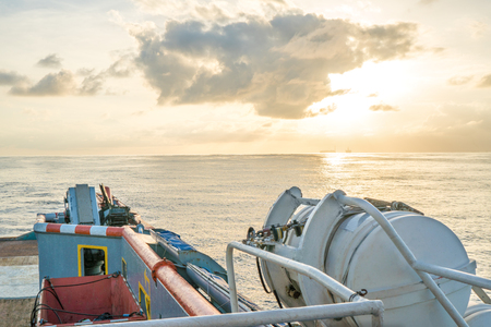 Front view of ocean boat or vessel sailing through calm sea. Freedom conceptの写真素材