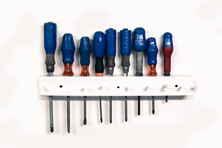 set of old screwdriver tools on white background